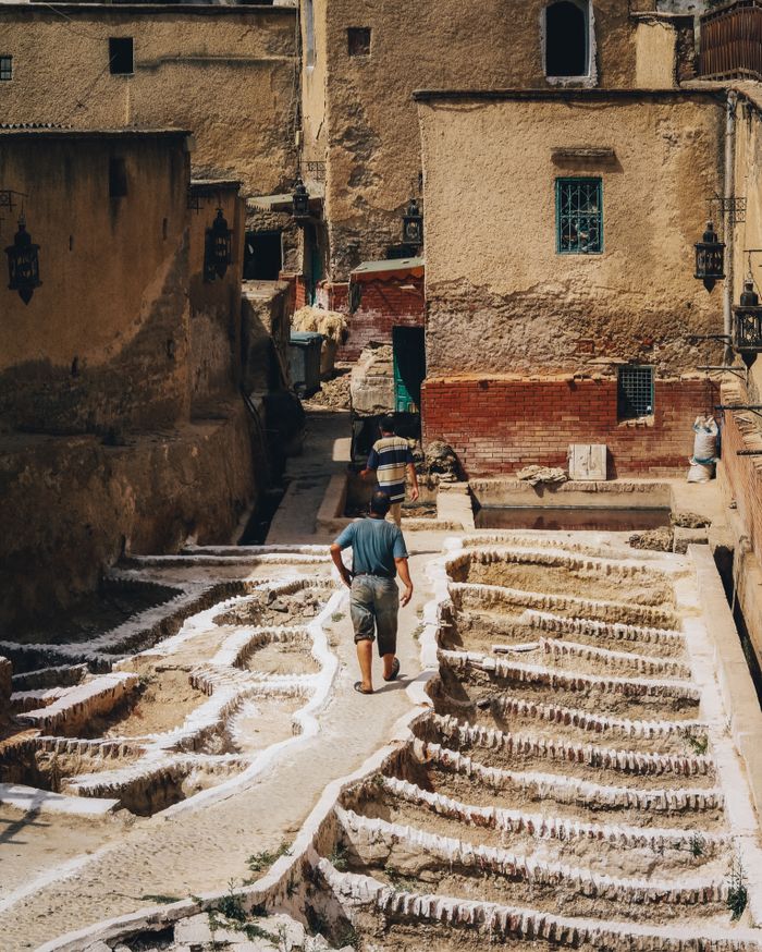 service-02 Man walking through the historic terraced paths of Tétouan, Morocco.