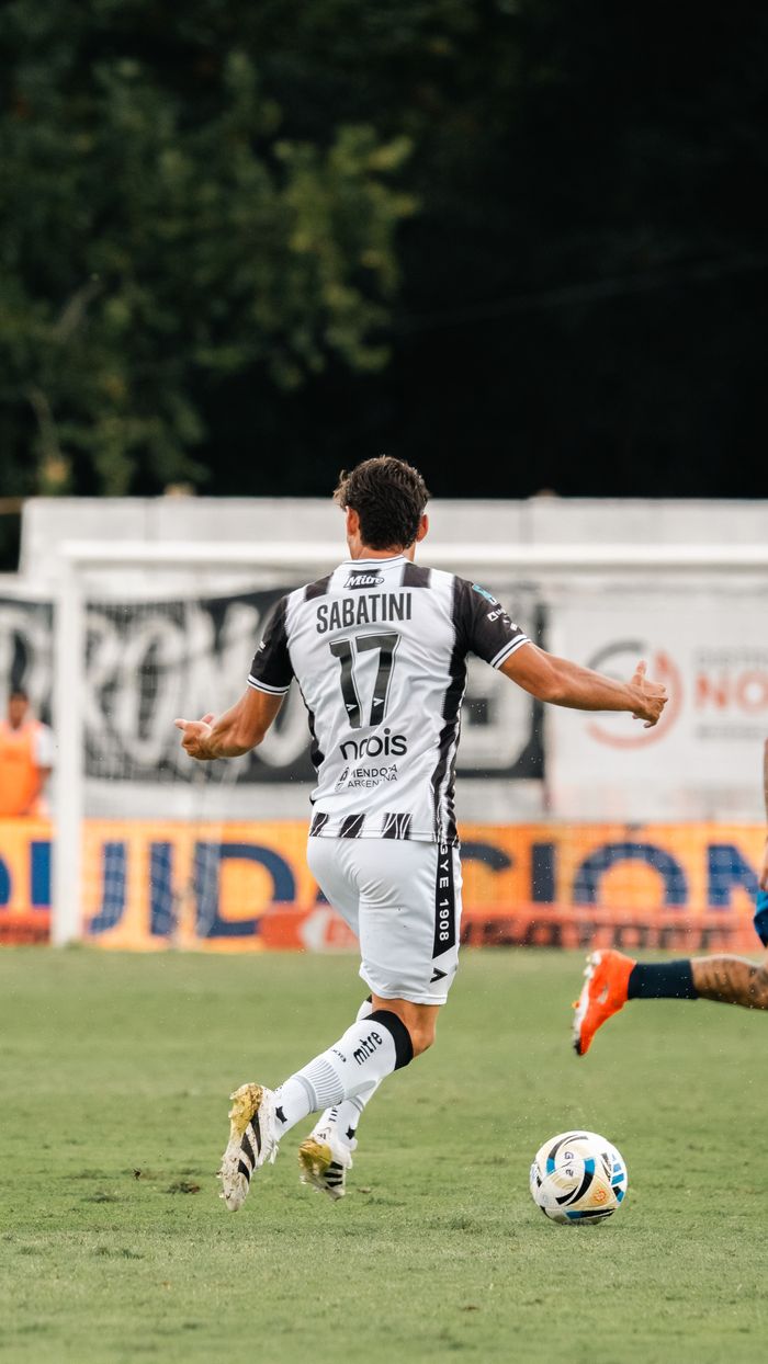The Art of Drawing Readers In: Your attractive post title goes here Dynamic shot of a soccer player in motion during a competitive match outdoors.